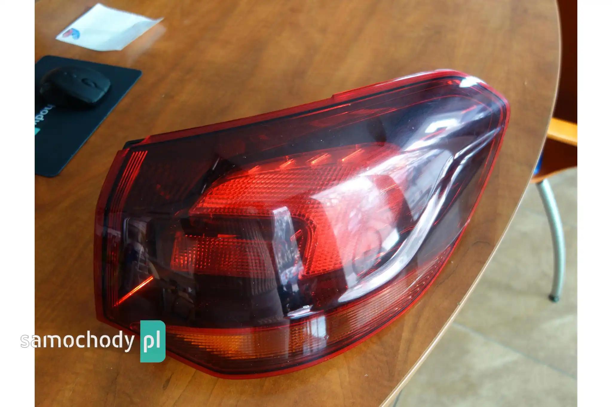 Lampy przednie i elementy Opel